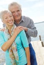 Committed to each other. Portrait of a senior couple embracing each other on a jetty.