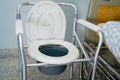 Commode chair or mobile toilet can moving in bedroom or everywhere for elderly old disabled people or patient in hospital, healthy Royalty Free Stock Photo