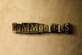 COMMODITIES - close-up of grungy vintage typeset word on metal backdrop