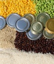 commodity close up with coffee bean, metal lids, corn, full grain rice and soybeans commodity Royalty Free Stock Photo