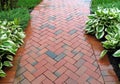 Common  brick sidewalk geometric  design for gardens and historic neighborhoods Royalty Free Stock Photo