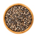 Common buckwheat seeds with hulls in wooden bowl