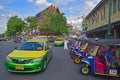 Common colourful means of transport at road intersection in front of Wat Pho