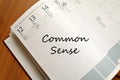 Common sense write on notebook Royalty Free Stock Photo