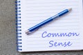 Common sense write on notebook Royalty Free Stock Photo