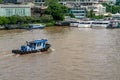 A common sight of Tugboats cruising along the famous Chao Praya River, Bangkok, Thailand. Royalty Free Stock Photo