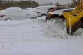 It is common for snowplow trucks to remove snow from parking lots following heavy a snowfall