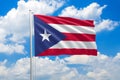 Puerto Rico national flag waving in the wind on clouds sky. High quality fabric. International relations concept Royalty Free Stock Photo