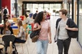 Communal Area Of Busy College Campus With Students