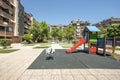 Communal recreational area for children, swings, slides and swimming pool in the center