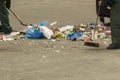 Communal service workers clean street from garbage