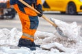 Communal services worker sweeps snow from road in winter, Cleaning city streets and roads during snowstorm. Moscow, Russia Royalty Free Stock Photo