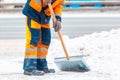 Communal services worker sweeps snow from road in winter, Cleaning city streets and roads during snowstorm. Moscow, Russia Royalty Free Stock Photo