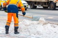 Communal services worker sweeps snow from road in winter, Cleaning city streets and roads during snowstorm. Moscow, Russia Royalty Free Stock Photo