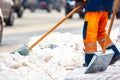 Communal services workers sweep snow from road in winter, Cleaning city streets and roads during snowstorm. Moscow, Russia Royalty Free Stock Photo