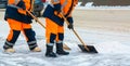 Communal services workers sweep snow from road in winter, Cleaning city streets and roads after snow storm. Moscow, Russia Royalty Free Stock Photo