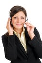 Communcations business woman holding her headset Royalty Free Stock Photo