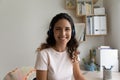 Headshot portrait of happy young woman wearing headset at home Royalty Free Stock Photo