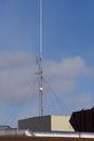 Communication antennae on a business rooftop. Royalty Free Stock Photo