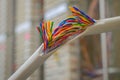 Communication breakdown is close up. Damaged insulating material of a stranded telephone wire. Gap color telecommunication cable.