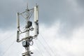 Communication cellular signal tower. 3G, 4G, 5G phone signal base station. Urban antenna repeater tower. Storm warning Royalty Free Stock Photo