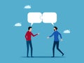 Communication or collaboration. Two men talking with jigsaw speech bubbles Royalty Free Stock Photo