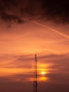 Communication GSM and internet antenna silhouette with dramatic sunset sky in background Royalty Free Stock Photo