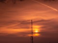 Communication GSM and internet antenna silhouette with dramatic sunset sky in background Royalty Free Stock Photo