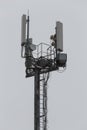 communication and gsm, wcdma, hspda and other 3g, 4g standarts tower close-up in cloudy weather