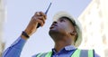 Communication, radio and construction worker, man or manager for project management in urban city. African builder in Royalty Free Stock Photo