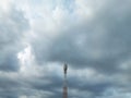 The Communication Signal Tower Rises High Into the Sky During the Hot Day