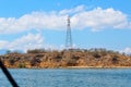 The Communication Signal Tower Rises High Into the Sky During the Hot Day