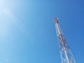 The Communication Signal Tower Rises High Into the Sky During the Hot Day