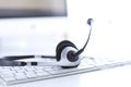 Communication support, call center and customer service help desk. VOIP headset on laptop computer keyboard Royalty Free Stock Photo