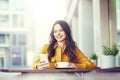 Happy woman texting on smartphone at city cafe Royalty Free Stock Photo