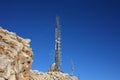 Communication, telecommunication and television antennas, positioned between the rocks of the mountains at the top