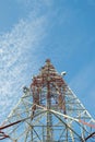 Communication tower against blue sky.