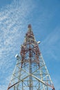 Communication tower against blue sky.