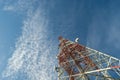 Communication tower against blue sky.