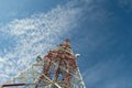 Communication tower against blue sky.