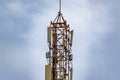 Communication tower with blue sky and clouds moving background Royalty Free Stock Photo