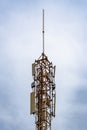 Communication tower with blue sky and clouds moving background Royalty Free Stock Photo