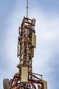 Communication tower with blue sky and clouds moving background Royalty Free Stock Photo