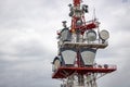 communication tower with control devices and antennas, transmitters and repeaters for mobile communications and the Royalty Free Stock Photo