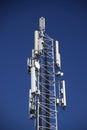 Communication tower with GSM, 4G, data and microwave antenna from several provider Royalty Free Stock Photo