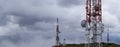 Communication towers and cloudy sky Royalty Free Stock Photo