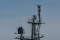 Communications tower on naval frigate against clear blue sky Royalty Free Stock Photo