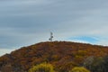 A Communications Tower Sits Atop a Mountain Covered with Beautiful Fall Foliage