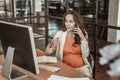 Communicative dark-haired woman talking on her smartphone