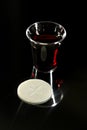 Communion Cup with Wine and Wafer Royalty Free Stock Photo